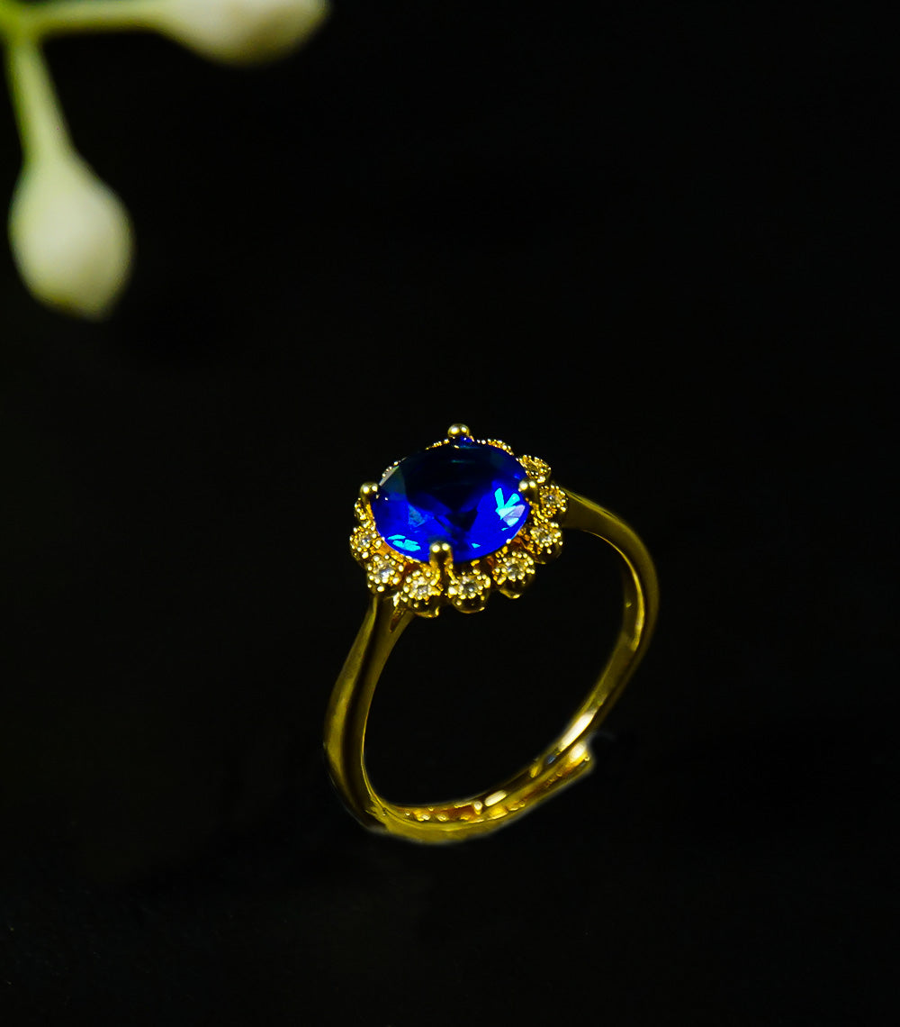 Golden rings with  blue stone