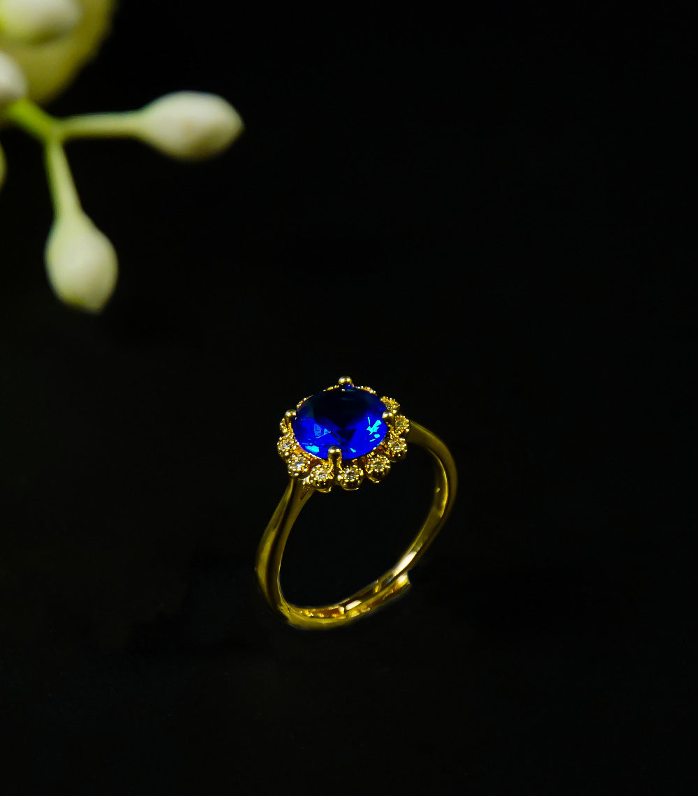 Golden rings with  blue stone