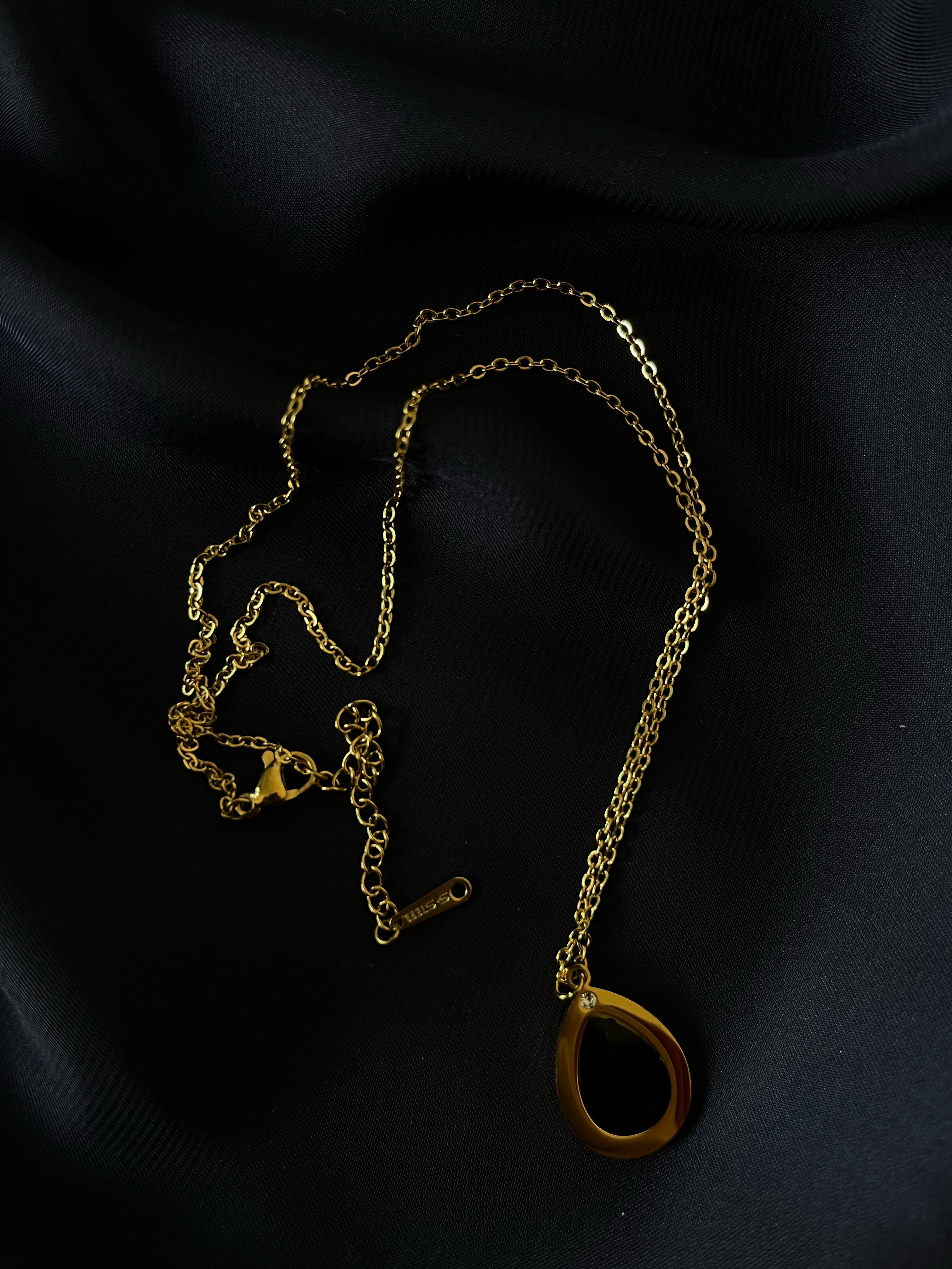 Golden Oval Black Stone Pendant