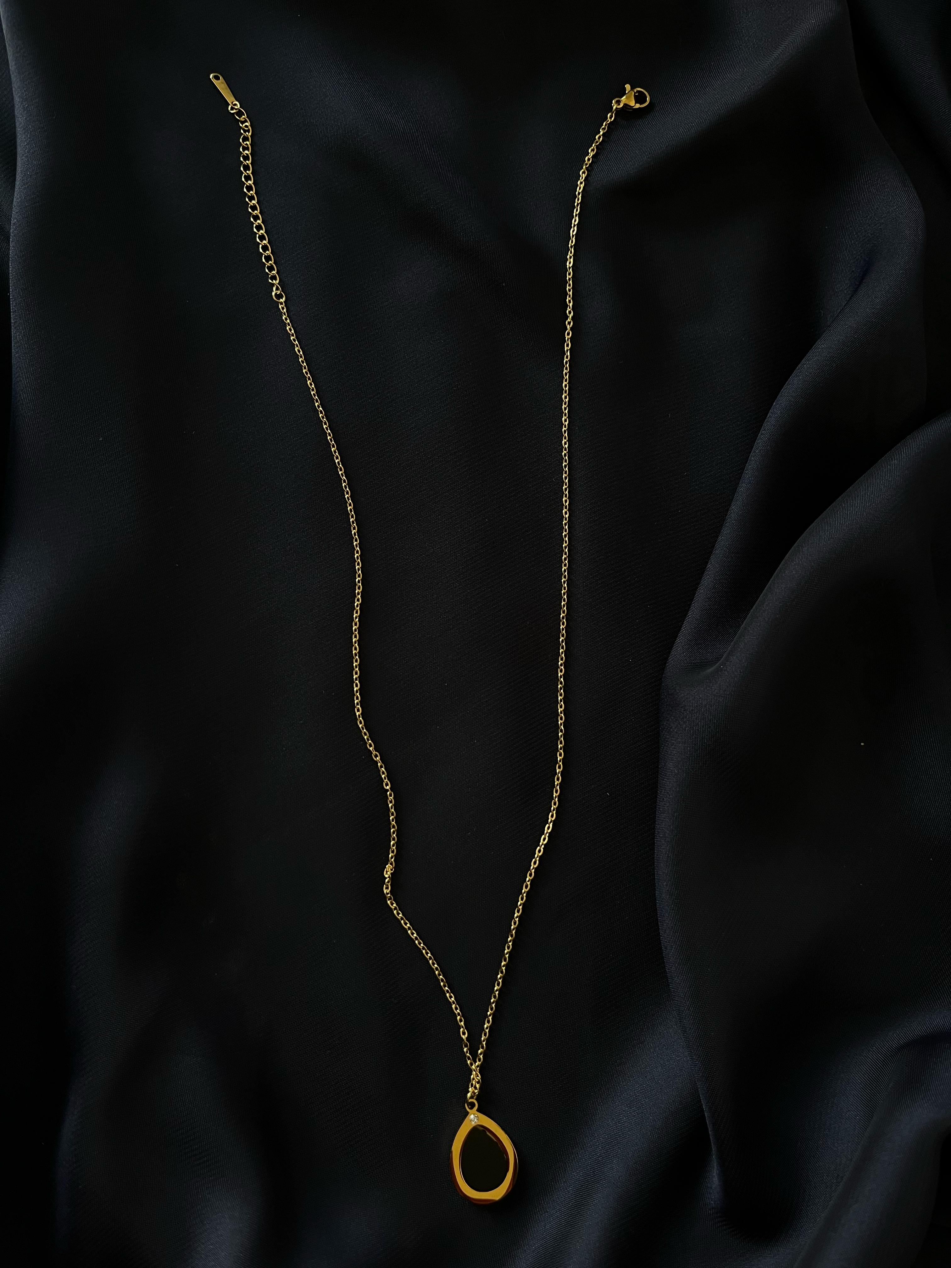 Golden Oval Black Stone Pendant