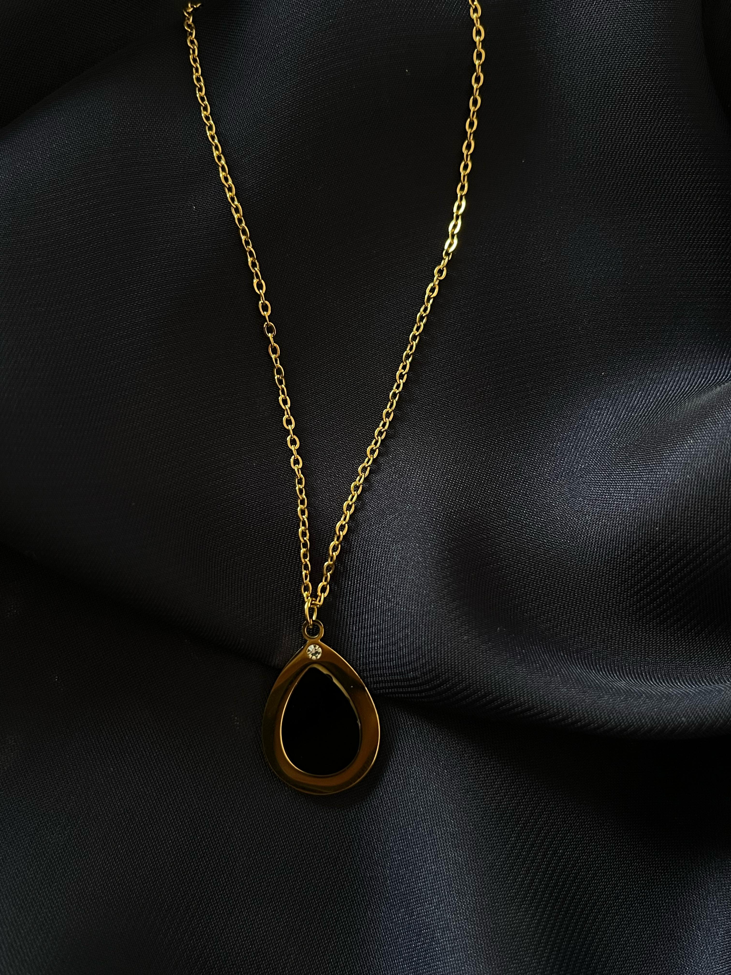 Golden Oval Black Stone Pendant