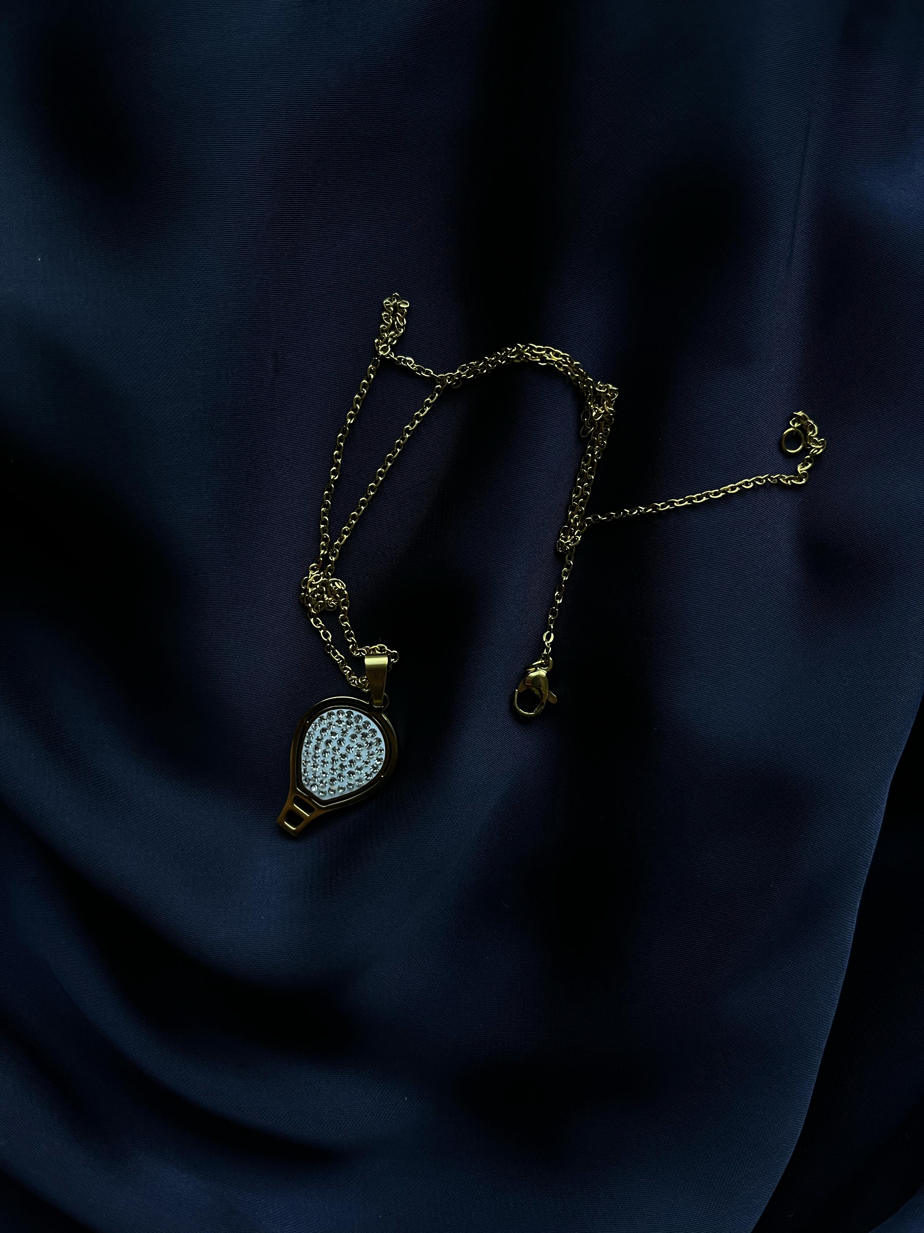 Golden Pendant with Oval Silver Stone