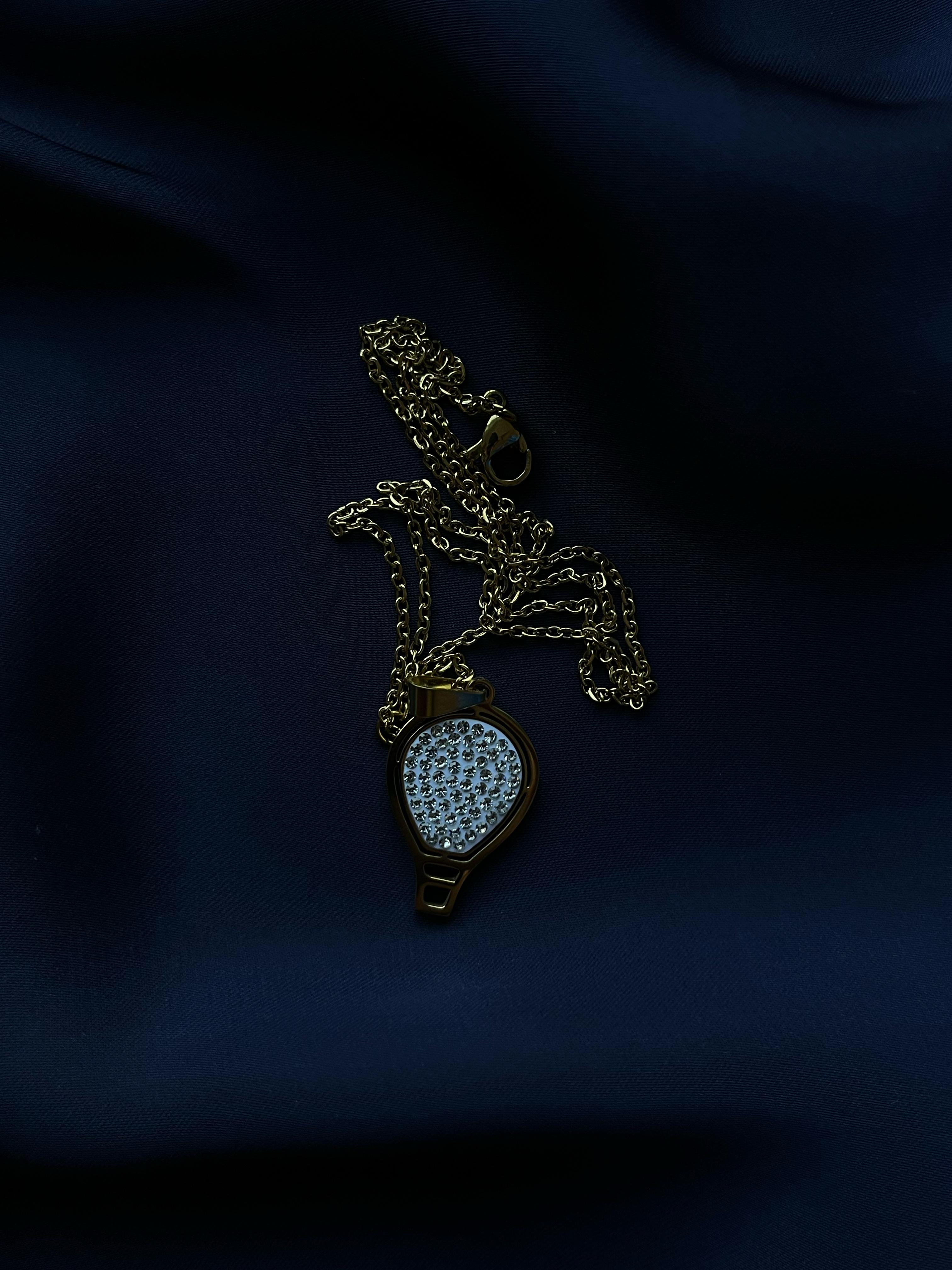 Golden Pendant with Oval Silver Stone